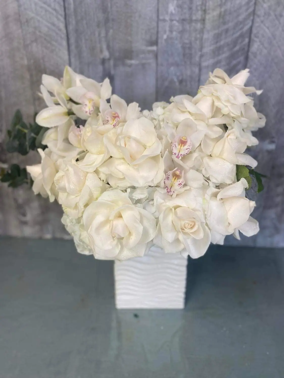 Elegant Orchids and White Roses